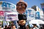 A puppet of Argentina's President Javier Milei is seen during a demonstration during a national strike against the government of Javier Milei in downtown Buenos Aires, on January 24, 2024. Argentine President Javier Milei faces the first national strike in just 45 days of government, against his draconian fiscal adjustment and his plan to reform more than a thousand laws and regulations that governed for decades. The largest Argentine union called the strike in rejection, in particular, of the changes by decree to the labor regime promoted by Milei, which limit the right to strike and affect the financing of unions. (Photo by TOMAS CUESTA / AFP)Editoria: POLLocal: Buenos AiresIndexador: TOMAS CUESTASecao: strikeFonte: AFPFotógrafo: STF<!-- NICAID(15658717) -->
