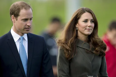 (FILES) In this file picture taken on October 9, 2012 Prince William The Duke of Cambridge (L) and his wife Catherine the Duchess of Cambridge walk together during the opening of the Football Associations National Fooball Centre, St Georges Park in Burton Upon Trent.  Buckingham Palace announced on December 3, 2012 that Prince William The Duke of Cambridge and his wife Catherine the Duchess of Cambridge are expecting a baby. AFP PHOTO/Adrian DENNIS<!-- NICAID(8873198) -->