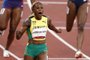 Jamaica's Elaine Thompson-Herah celebrates after winning the women's 100m final and setting a new Olympic Record during the Tokyo 2020 Olympic Games at the Olympic Stadium in Tokyo on July 31, 2021. (Photo by Odd ANDERSEN / AFP)Editoria: SPOLocal: TokyoIndexador: ODD ANDERSENSecao: athletics, track and fieldFonte: AFPFotógrafo: STF<!-- NICAID(14850475) -->