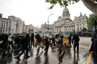 Demonstrators clash with members of the Argentina's National Guard during a demonstration against the government of Argentina's President Javier Milei in Buenos Aires on October 15, 2026. (Photo by Emiliano Lasalvia / AFP)<!-- NICAID(16388503) -->