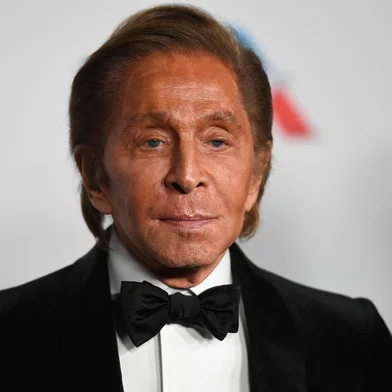 (FILES) Italian fashion designer Valentino Garavani poses on the red carpet upon arrival to attend the British Fashion Awards 2018 in London on December 10, 2018. Italian designer Valentino Garavani has died at age 93, Italy's ANSA news agency reported on January 19, 2026.  The giant in the world of haute couture died at his home in Rome, the agency reported, citing the Valentino Garavani Foundation and the designer's longtime partner, Giancarlo Giammetti. (Photo by ANGELA WEISS / AFP)<!-- NICAID(16206601) -->