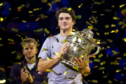Brazil's Joao Fonseca poses with the trophy after winning against Spain's Alejandro Davidovich Fokina in their men's final match at the Swiss Indoors ATP 500 tennis tournament in Basel on October 26, 2025. (Photo by Fabrice COFFRINI / AFP)<!-- NICAID(16154525) -->