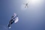 A helicopter carries a giant t-shirt of Argentine forward Lionel Messi over Rosario, Argentina, on December 13, 2022, before the Qatar 2022 World Cup semi-final football match between Argentina and Croatia. (Photo by AFP)<!-- NICAID(15294466) -->