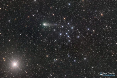Explanation: Imaged on June 20 2022, comet C/2017 K2 (PanSTARRS) shares this wide telescopic field of view with open star cluster IC 4665 and bright star Beta Ophiuchi, near a starry edge of the Milky Way. On its maiden voyage to the inner Solar System from the dim and distant Oort cloud, this comet PanSTARRS was initially spotted over five years ago, in May 2017. Then it was the most distant active inbound comet ever found, discovered when it was some 2.4 billion kilometers from the Sun. That put it between the orbital distances of Uranus and Saturn. Hubble Space Telescope observations indicated the comet had a large nucleus less than 18 kilometers in diameter. Now visible in small telescopes C/2017 K2 will make its closest approach to planet Earth on July 14 and closest approach to the Sun this December. Its extended coma and developing tail are seen here at a distance of some 290 million kilometers, a mere 16 light-minutes away.<!-- NICAID(15145821) -->