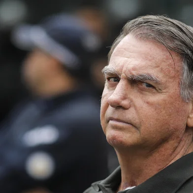(FILES) Former Brazilian President (2019-2022) Jair Bolsonaro leaves the DF Star hospital in Brasilia on September 14, 2025, after undergoing a series of medical examinations, as he remains under house arrest. Ex-President Bolsonaro was taken from house arrest into police custody on November 22, 2025, as he is considered a flight risk, according to a Supreme Court ruling. Judge Alexandre de Moraes said Bolsonaro, who has been sentenced to 27 years in prison over a botched coup bid but has yet to begin serving his term, was a "high flight risk". (Photo by Sergio Lima / AFP)Editoria: POLLocal: BrasíliaIndexador: SERGIO LIMASecao: trialsFonte: AFPFotógrafo: STR<!-- NICAID(16174198) -->