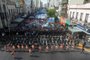 Aerial view showing security forces standing guard as members of social movements protest against cuts by the government of President Javier Milei in the most vulnerable sectors, on March 18, 2024, at the Pueyrredon bridge in Avellaneda, Buenos Aires Province, Argentina. (Photo by Luis ROBAYO / AFP)<!-- NICAID(15709354) -->