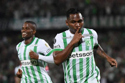 Atletico Nacional's forward #09 Alfredo Morelos (R) celebrates after scoring with teammate defender #06 Andres Roman during the Copa Libertadores group stage first round football match between Colombia's Atletico Nacional and Uruguay's Nacional at the Atanasio Girardot stadium in Medellin, Antioquia department, Colombia, on April 2, 2025. (Photo by Jaime SALDARRIAGA / AFP)<!-- NICAID(16012317) -->