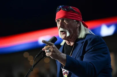 (FILES) US pro-wrestler Hulk Hogan speaks during the last day of the 2024 Republican National Convention at the Fiserv Forum in Milwaukee, Wisconsin, on July 18, 2024. Hulk Hogan, the iconic face of professional wrestling in the 1980s who parlayed his prowess in the ring into an acting career, has died at the age of 71, US media reported on July 24, 2025. Hogan -- known for his towering 6'7" (two-meter) physique, bandana and distinctive blond handlebar mustache -- died at his home in Florida, NBC News reported, citing his manager Chris Volo. TMZ also reported the news, citing unnamed sources. (Photo by Jim WATSON / AFP)<!-- NICAID(16087112) -->