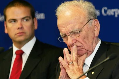 (FILES) This October 26, 2004, file photo shows Chairman of  News Corp. Rupert Murdoch (R), with his son Lachlan (L), in Adelaide, Australia. Rupert Murdoch will step down as chairman of his global media empire, handing the post to son Lachlan, Fox Corp. and News Corp. announced Thursday. The Australian-born 92-year-old, who built a global entertainment and news juggernaut, will shift into an emeritus status at both companies in mid-November, the companies said. (Photo by William WEST / AFP)<!-- NICAID(15547251) -->