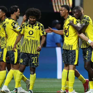 Borussia Dortmund's Guinean forward #09 Serhou Guirassy (R) celebrates scoring his team's second goal with teammates during the FIFA Club World Cup 2025 round of 16 football match between Germany's Borussia Dortmund and Mexico's Monterrey at the Mercedes-Benz Stadium in Atlanta on July 1, 2025. (Photo by CHARLY TRIBALLEAU / AFP)<!-- NICAID(16071455) -->