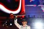 LAS VEGAS, NEVADA - NOVEMBER 18: Race winner Max Verstappen of the Netherlands and Oracle Red Bull Racing celebrates on the podium during the F1 Grand Prix of Las Vegas at Las Vegas Strip Circuit on November 18, 2023 in Las Vegas, Nevada. Mark Thompson/Getty Images/AFP