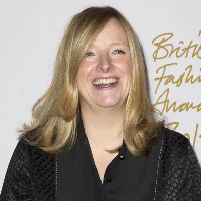 (FILES) British fashion designer Sarah Burton,  creative director of fashion brand Alexander McQueen and the designer of Catherine Middleton's dress for her wedding to Prince William, Duke of Cambridge,  poses in the winners' room with the Red Carpet Designers award during the British Fashion Awards 2014 in London on December 1, 2014. Givenchy announced on a press release on September 9, 2024 the appointment of British fashion designer Sarah Burton as their new artistic director. (Photo by Justin TALLIS / AFP)<!-- NICAID(15861790) -->