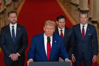 US President Donald Trump addresses the nation, alongside US Vice President JD Vance (L), US Secretary of State Marco Rubio (2nd R) and US Secretary of Defense Pete Hegseth (R), from the White House in Washington, DC on June 21, 2025, following the announcement that the US bombed nuclear sites in Iran. President Donald Trump said June 21, 2025 the US military has carried out a "very successful attack" on three Iranian nuclear sites, including the underground uranium enrichment facility at Fordo. "We have completed our very successful attack on the three Nuclear sites in Iran, including Fordow, Natanz, and Esfahan," Trump said in a post on his Truth Social platform. (Photo by CARLOS BARRIA / POOL / AFP)<!-- NICAID(16064897) -->