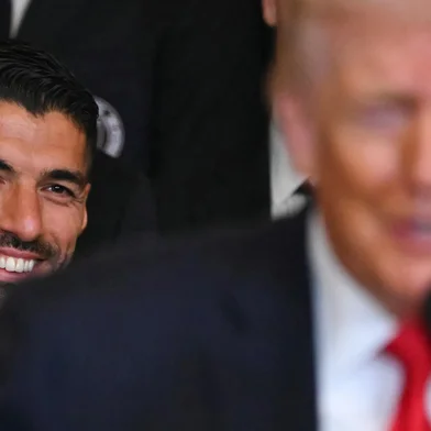 Inter Miami's Uruguayan forward Luis Suarez smiles as he listen to US President Donald Trump speak during an event honoring the winners of the 2025 Major League Soccer Cup, in the East Room of the White House in Washington, DC, on March 5, 2026. (Photo by ANDREW CABALLERO-REYNOLDS / AFP)<!-- NICAID(16239272) -->