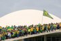 Supporters of Brazilian former President Jair Bolsonaro invade the National Congress in Brasilia on January 8, 2023. - Hundreds of supporters of Brazil's far-right ex-president Jair Bolsonaro broke through police barricades and stormed into Congress, the presidential palace and the Supreme Court Sunday, in a dramatic protest against President Luiz Inacio Lula da Silva's inauguration last week. (Photo by Sergio Lima / AFP)Editoria: WARLocal: BrasíliaIndexador: SERGIO LIMASecao: demonstrationFonte: AFPFotógrafo: STR<!-- NICAID(15315548) -->