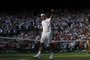 Switzerland's Roger Federer celebrates beating Japan's Kei Nishikori during their men's singles quarter-final match on day nine of the 2019 Wimbledon Championships at The All England Lawn Tennis Club in Wimbledon, southwest London, on July 10, 2019. (Photo by Adrian DENNIS / AFP) / RESTRICTED TO EDITORIAL USEEditoria: SPOLocal: LondonIndexador: ADRIAN DENNISSecao: tennisFonte: AFPFotógrafo: STF<!-- NICAID(14159143) -->