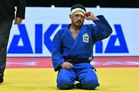 Brazil's Daniel Cargnin (blue) reacts during the men`s -73kg final of the Judo World Championships in Budapest, Hungary, on June 15, 2025. (Photo by Attila KISBENEDEK / AFP)<!-- NICAID(16060440) -->