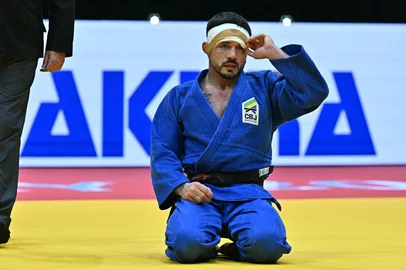 Brazil's Daniel Cargnin (blue) reacts during the men`s -73kg final of the Judo World Championships in Budapest, Hungary, on June 15, 2025. (Photo by Attila KISBENEDEK / AFP)<!-- NICAID(16060440) -->