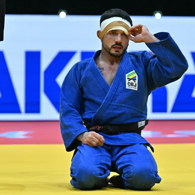 Brazil's Daniel Cargnin (blue) reacts during the men`s -73kg final of the Judo World Championships in Budapest, Hungary, on June 15, 2025. (Photo by Attila KISBENEDEK / AFP)<!-- NICAID(16060440) -->