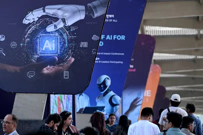 Visitors arrive to attend the AI Impact Summit in New Delhi on February 17, 2026. (Photo by Arun SANKAR / AFP)<!-- NICAID(16231029) -->
