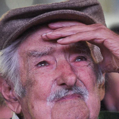 Former Uruguayan President Jose Mujica reacts after receiving a tribute during the 54th anniversary of the Frente Amplio political coalition in Montevideo on March 26, 2025. (Photo by Sofia TORRES / AFP)Editoria: POLLocal: MontevideoIndexador: SOFIA TORRESSecao: politics (general)Fonte: AFPFotógrafo: STR<!-- NICAID(16035308) -->