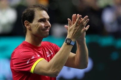 Spain's Rafael Nadal applauds during a tribute to his career at the end of the quarter-final doubles match between Netherlands and Spain during the Davis Cup Finals at the Palacio de Deportes Jose Maria Martin Carpena arena in Malaga, southern Spain, on November 19, 2024. Superstar Rafael Nadal's glittering career in professional tennis came to an end on November 19, 2024 as Netherlands eliminated Spain in the Davis Cup quarter-finals. (Photo by Thomas COEX / AFP)<!-- NICAID(15917283) -->