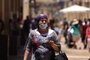 An Israeli woman wears a protective mask against Covid-19 in Jerusalem on June 25, 2021. - The Israeli health ministry reimposed a requirement for masks to be worn in enclosed public places following a surge in Covid cases since it was dropped 10 days ago. (Photo by Emmanuel DUNAND / AFP)<!-- NICAID(14818021) -->