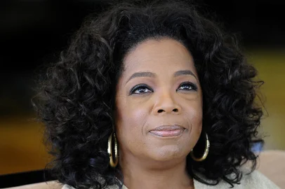 US talk show queen Oprah Winfrey looks on as she answers to journalist's questions at her South African girls' academy on January 13, 2012 in Henley on Klip. Winfrey founded the $40-million school for girls in 2007.  Lance Armstrong, the ex-cyclist drummed out of the sport for doping, answered the questions that "people around the world have been waiting to hear" in an two-and-a-half hour interview, talk show host Oprah Winfrey said January 15, 2013. "I didn't get all the questions asked, but I think the most important questions and the answers that people around the world have been waiting to hear were answered," she said on CBS "This Morning." "I can only say I was satisfied by the answers." Armstrong, who has consistently denied drug-taking, on Monday recorded a two-and-a-half hour interview with Winfrey in his hometown Austin, Texas. AFP PHOTO/ STEPHANE DE SAKUTIN / FILES<!-- NICAID(9657488) -->