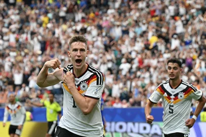 Germany's defender #15 Nico Schlotterbeck celebrates after scoring his team's second goal  during the 2026 World Cup Group E football match between Germany and Curacao at the Houston Stadium in Houston on June 14, 2026.  (Photo by RONALDO SCHEMIDT / AFP)<!-- NICAID(16306033) -->