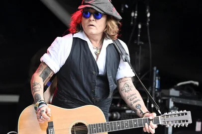 (FILES) In this file photo taken on June 19, 2022 Johnny Depp performs on stage with Jeff Beck during the Helsinki Blues Festival in Helsinki. - Fresh off his highly publicized, controversial defamation suit, actor Depp sought to show his creative career was back on track on July 15, 2022,, releasing an album with English rocker Jeff Beck. The 13-track album "18" on which Depp sings and plays guitar features mainly covers, and so far it has been critically panned. It's a record unlikely to figure prominently in the repertoire of Beck, the 78-year-old former member of The Yardbirds. (Photo by Jussi Nukari / Lehtikuva / AFP) / Finland OUT<!-- NICAID(15150897) -->
