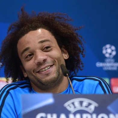 Real Madrid's Brazilian defender Marcelo smiles during a press conference after a training session at Valdebebas sport city in Madrid on November 2, 2015 on the eve of their Champions' League football match against Paris Saint Germain. AFP PHOTO/ PIERRE-PHILIPPE MARCOU<!-- NICAID(11793743) -->