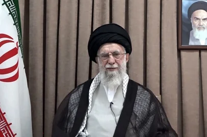 This handout picture provided by the office of Iran's Supreme Leader Ayatollah Ali Khamenei shows him, flanked by the Iranian flag and a portrait of his predecessor the late supreme leader and Iranian revolution leader Ayatollah Ruhollah Khomeini, giving a televised address in Tehran on June 18, 2025. Iran's supreme leader on June 18 described as "unacceptable" an ultimatum from US President Donald Trump calling for the nation's "unconditional surrender".