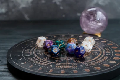 Horoscope zodiac circle with divination dice. Fortune telling and astrology predictions concept, magic rituals and exoteric experience<!-- NICAID(16062612) -->