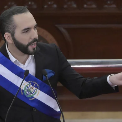 (FILES) Salvadoran President Nayib Bukele delivers his annual address to the nation marking his third year in office at the San Salvador Legislative Assembly on June 1, 2022. El Salvador's gang-busting President Nayib Bukele has proudly embraced the monicker of "dictator" and breezily shrugs off criticism of human rights transgressions. In five years in power, the 42-year-old millennial businessman and former mayor has become globally known, and domestically loved, for his no-holds-barred "war" on drug gangs. (Photo by MARVIN RECINOS / AFP)<!-- NICAID(15669331) -->