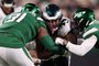 EAST RUTHERFORD, NEW JERSEY - OCTOBER 15: Kenneth Gainwell #14 of the Philadelphia Eagles is tackled by John Franklin-Myers #91 of the New York Jets during the second half at MetLife Stadium on October 15, 2023 in East Rutherford, New Jersey.   Dustin Satloff/Getty Images/AFP (Photo by Dustin Satloff / GETTY IMAGES NORTH AMERICA / Getty Images via AFP)<!-- NICAID(15571239) -->