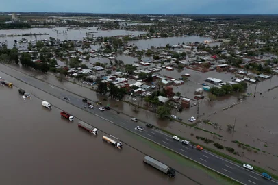 Aerial view showing a flooded area following heavy rainstorms in Campana, Buenos Aires province on May 17, 2025. More than a thousand people have been evacuated in Argentina due to flooding caused by heavy rains that have been lashing the province of Buenos Aires for more than 24 hours, in a storm that is expected to intensify on Saturday, local authorities said. (Photo by Luis ROBAYO / AFP)<!-- NICAID(16040564) -->
