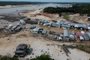 Floating houses and boats are seen stranded at the Marina do Davi, a docking area of the Negro river, city of Manaus, Amazonas State, northern Brazil, on October 16, 2023. The Negro river is facing the worst dry season of the last decades in the Amazon rainforest. (Photo by MICHAEL DANTAS / AFP)Editoria: DISLocal: ManausIndexador: MICHAEL DANTASSecao: droughtFonte: AFPFotógrafo: STR<!-- NICAID(15570794) -->
