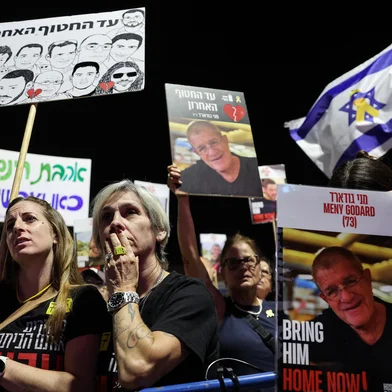 Women react during a rally organised by hostage families and calling for the return of the bodies of the remaining hostages still thought to be under the rubble of Gaza following their abduction by Hamas militants on October 7, 2023, at Hostages Square in Tel Aviv on November 1, 2025. (Photo by Jack GUEZ / AFP)<!-- NICAID(16158856) -->