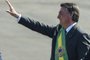 Brazilian President Jair Bolsonaro waves to supporters in his arrival to the flag-raising ceremony at Alvorada Palace, during the Independence Day celebrations in Brasilia, on September 7, 2021. - Fighting record-low poll numbers, a weakening economy and a judiciary he says is stacked against him, President Jair Bolsonaro has called huge rallies for Brazilian independence day Tuesday, seeking to fire up his far-right base. (Photo by EVARISTO SA / AFP)Editoria: POLLocal: BrasíliaIndexador: EVARISTO SASecao: politics (general)Fonte: AFPFotógrafo: STF<!-- NICAID(14882963) -->