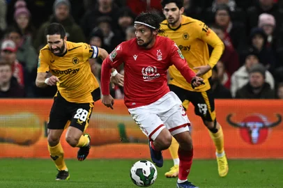 775919475Wolverhampton Wanderers' Portuguese midfielder Joao Moutinho (L) vies with Nottingham Forest's Brazilian midfielder Gustavo Scarpa (C) during the English League Cup quarter-final football match between Nottingham Forest and Wolverhampton Wanderers at The City Ground in Nottingham, central England, on January 11, 2023. (Photo by Paul ELLIS / AFP) / RESTRICTED TO EDITORIAL USE. No use with unauthorized audio, video, data, fixture lists, club/league logos or 'live' services. Online in-match use limited to 120 images. An additional 40 images may be used in extra time. No video emulation. Social media in-match use limited to 120 images. An additional 40 images may be used in extra time. No use in betting publications, games or single club/league/player publications. / Editoria: SPOLocal: NottinghamIndexador: PAUL ELLISSecao: soccerFonte: AFPFotógrafo: STF<!-- NICAID(15623855) -->