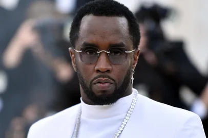 (FILES) Sean Combs 'P. Diddy' arrives for the 2018 Met Gala on May 7, 2018, at the Metropolitan Museum of Art in New York. Music mogul Sean Combs is set to go on trial for racketeering and sex trafficking on May 5, 2025, a judge said in a court hearing October 10, 2024. The rapper known as "Diddy" will remain incarcerated, said federal judge Arun Subramanian, after he was indicted last month on three criminal counts that allege he sexually abused women and coerced them into drug-fueled sex parties using threats and violence. (Photo by ANGELA WEISS / AFP)<!-- NICAID(15891523) -->