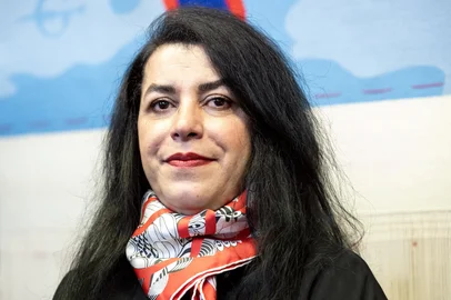 (FILES) French-Iranian graphic novelist and illustrator Marjane Satrapi poses during the unveiling of an Olympic triptych tapestry created for the Paris 2024 Olympic Games, designed from a drawing by Satrapi, at the Mobilier National (National Furniture) in Paris on March 12, 2024. The Franco-Iranian artist Marjane Satrapi, who gained worldwide recognition with the graphic novel and film "Persepolis," has died at the age of 56, AFP learned on June 4, 2026 from her relatives. (Photo by Bertrand GUAY / AFP)<!-- NICAID(16299770) -->