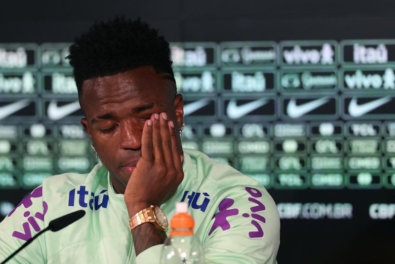 Brazil's forward Vinicius Junior cries as he gives a press conference on the eve of the international friendly football match between Spain and Brazil at the Ciudad Real Madrid training ground in Valdebebas, outskirts of Madrid, on March 25, 2024. Spain arranged a friendly against Brazil at the Santiago Bernabeu under the slogan "One Skin" to help combat racism. (Photo by Pierre-Philippe MARCOU / AFP)<!-- NICAID(15715247) -->