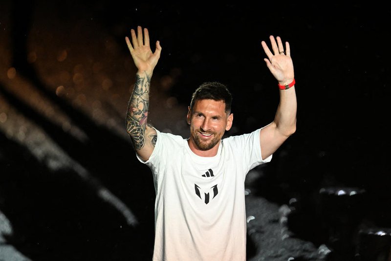 Argentine soccer star Lionel Messi waves as he is presented as the newest player for Major League Soccer's Inter Miami CF, at DRV PNK Stadium in Fort Lauderdale, Florida, on July 16, 2023. (Photo by CHANDAN KHANNA / AFP)<!-- NICAID(15484288) -->