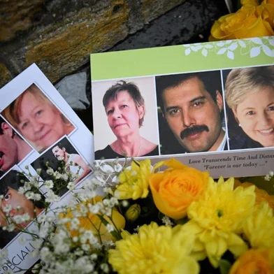 Tributes to the late British musician Freddie Mercury of rock band Queen are pictured outside his former home, Garden Lodge in Earl's Court, London on November 24, 2021, the 30th anniversary of the musician's death. (Photo by Daniel LEAL / AFP)<!-- NICAID(14949778) -->