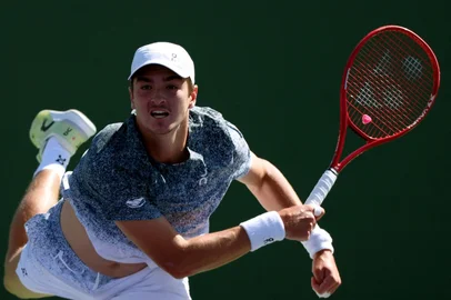 INDIAN WELLS, CALIFORNIA - MARCH 07: Joao Fonseca of Brazil serves in a match against Karen Kachhanov of Russia during Day 4 of the BNP Paribas Open at Indian Wells Tennis Garden on March 07, 2026 in Indian Wells, California.   Harry How/Getty Images/AFP (Photo by Harry How / GETTY IMAGES NORTH AMERICA / Getty Images via AFP)<!-- NICAID(16240426) -->