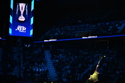 Spain's Carlos Alcaraz serves against Australia's Alex De Minaur at the ATP Finals tennis tournament in Turin on November 9, 2025. (Photo by Marco BERTORELLO / AFP)<!-- NICAID(16164143) -->