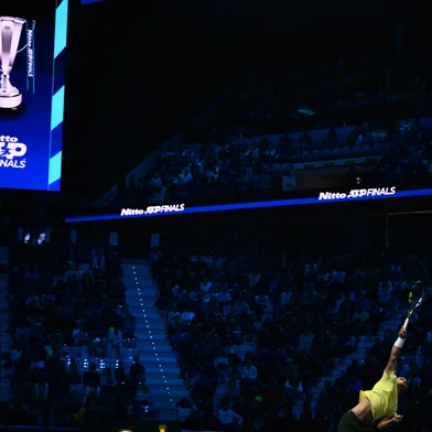 Spain's Carlos Alcaraz serves against Australia's Alex De Minaur at the ATP Finals tennis tournament in Turin on November 9, 2025. (Photo by Marco BERTORELLO / AFP)<!-- NICAID(16164143) -->