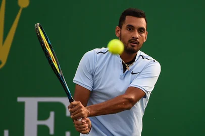 Nick Kyrgios of Australia hits a return during the men's singles against Steve Johnson of America at the Shanghai Masters tennis tournament in Shanghai on October 10, 2017. / AFP PHOTO / CHANDAN KHANNA<!-- NICAID(13204217) -->