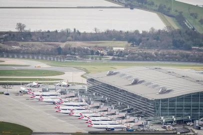 An aerial photograph taken on March 21, 2025 shows planes parked on the tarmac of Heathrow Airport following its closure after a fire broke out at a substation supplying power of the airport, in Hayes, west London. Britain's Heathrow airport, Europe's busiest, was shut down early on March 21 for 24 hours after a major fire at an electricity substation cut power to the sprawling facility west of London, officials said. (Photo by AFP)<!-- NICAID(16000426) -->